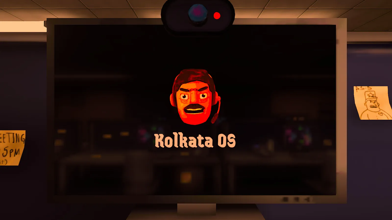 A monitor showing the Kolkata OS boot screen in a dark office